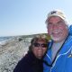 Selfie of Chris Budeski and woman by the beach
